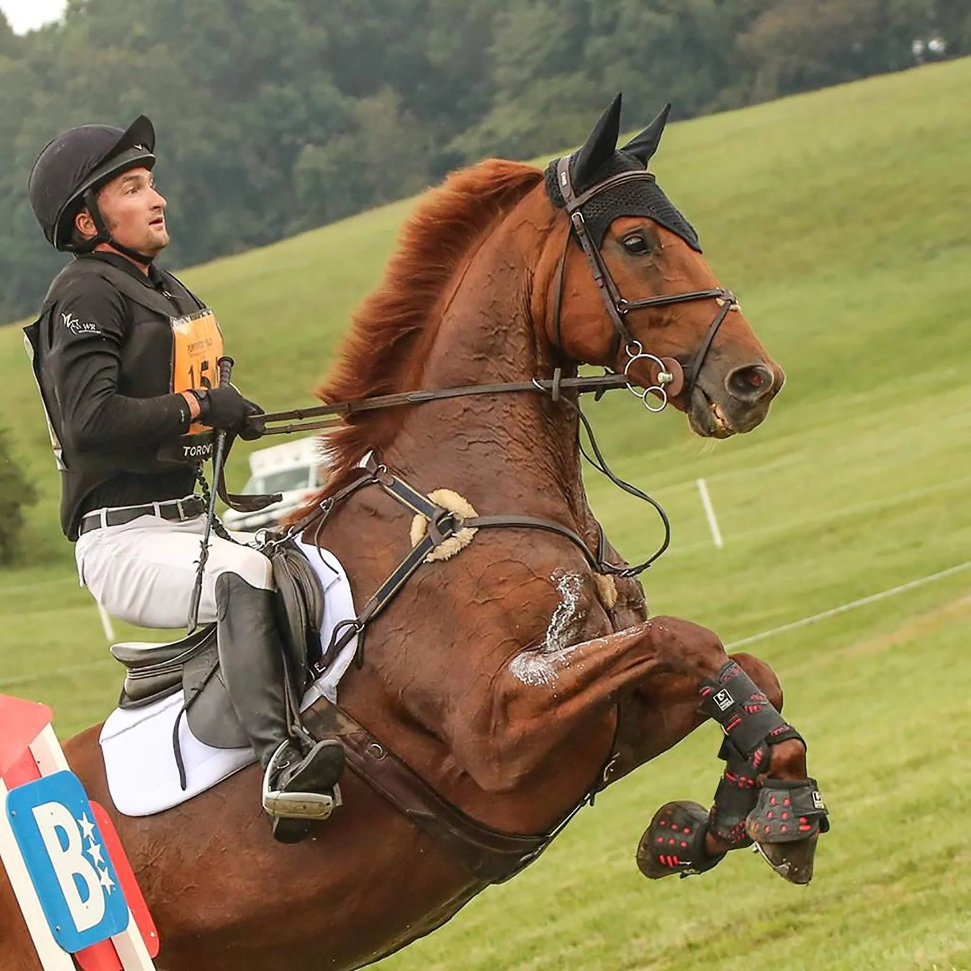Majyk Equipe Over Reach No Turn Notch Boot with Impact Protection – Pair worn during equestrian competition with horse.